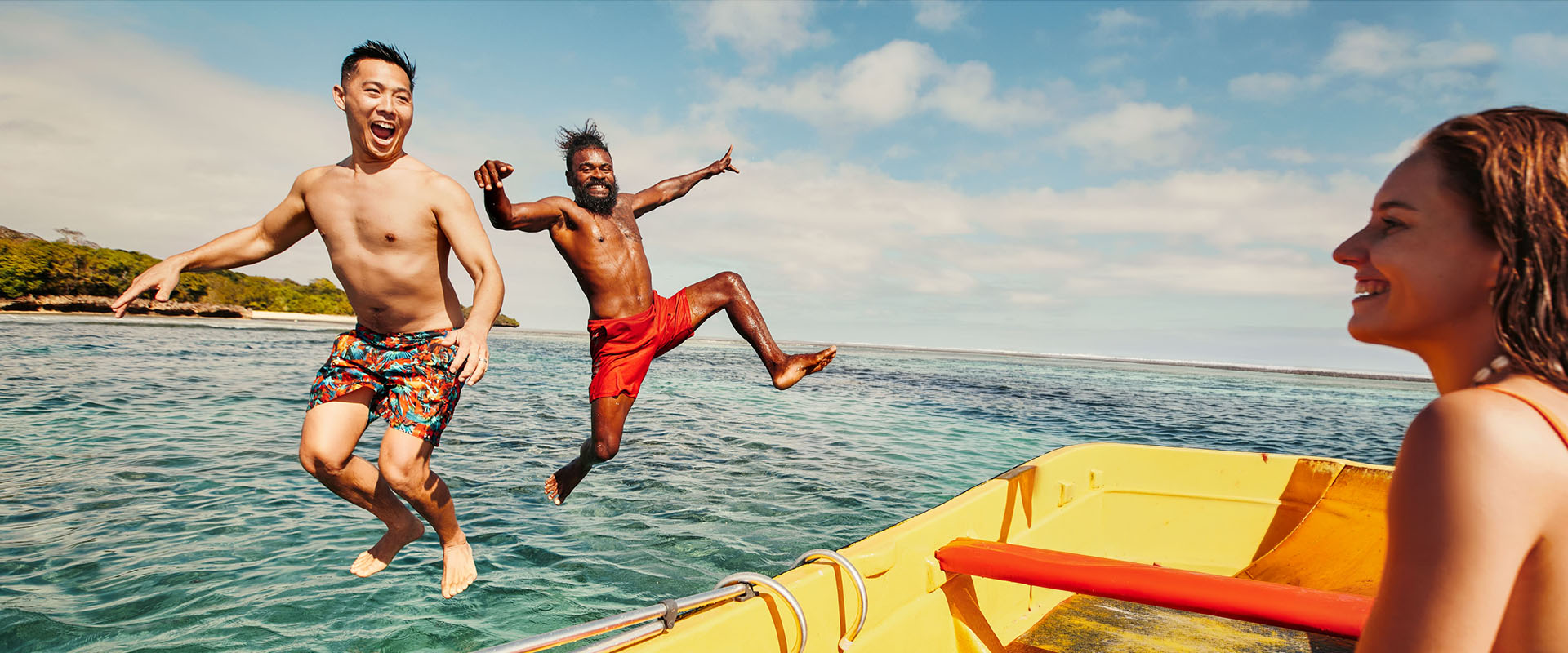 Family enjoying a Fiji beach holiday with paddleboards – Fiji holiday deals
