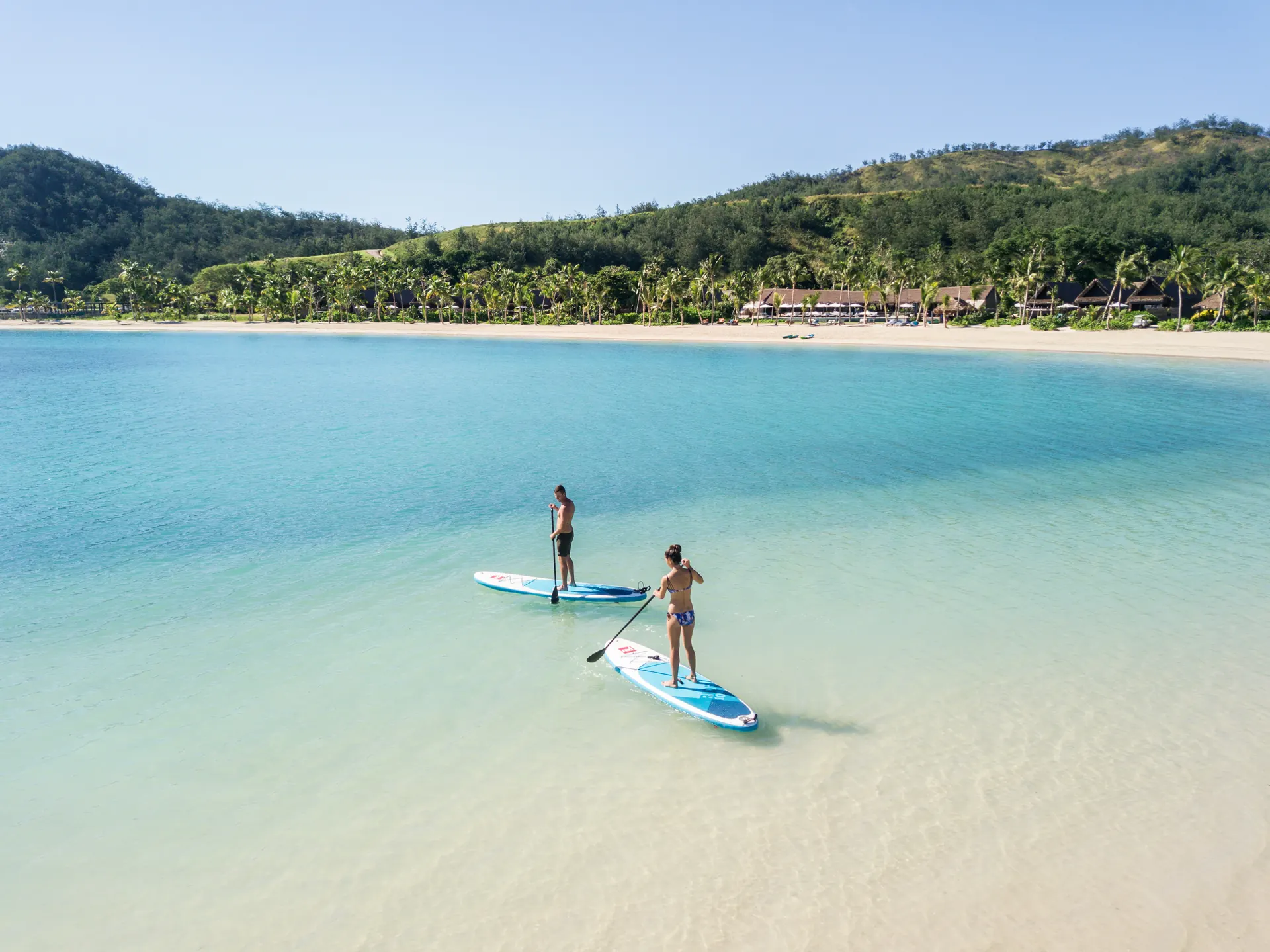 Stand-up paddleboarding in the lagoon at Six Senses Fiji