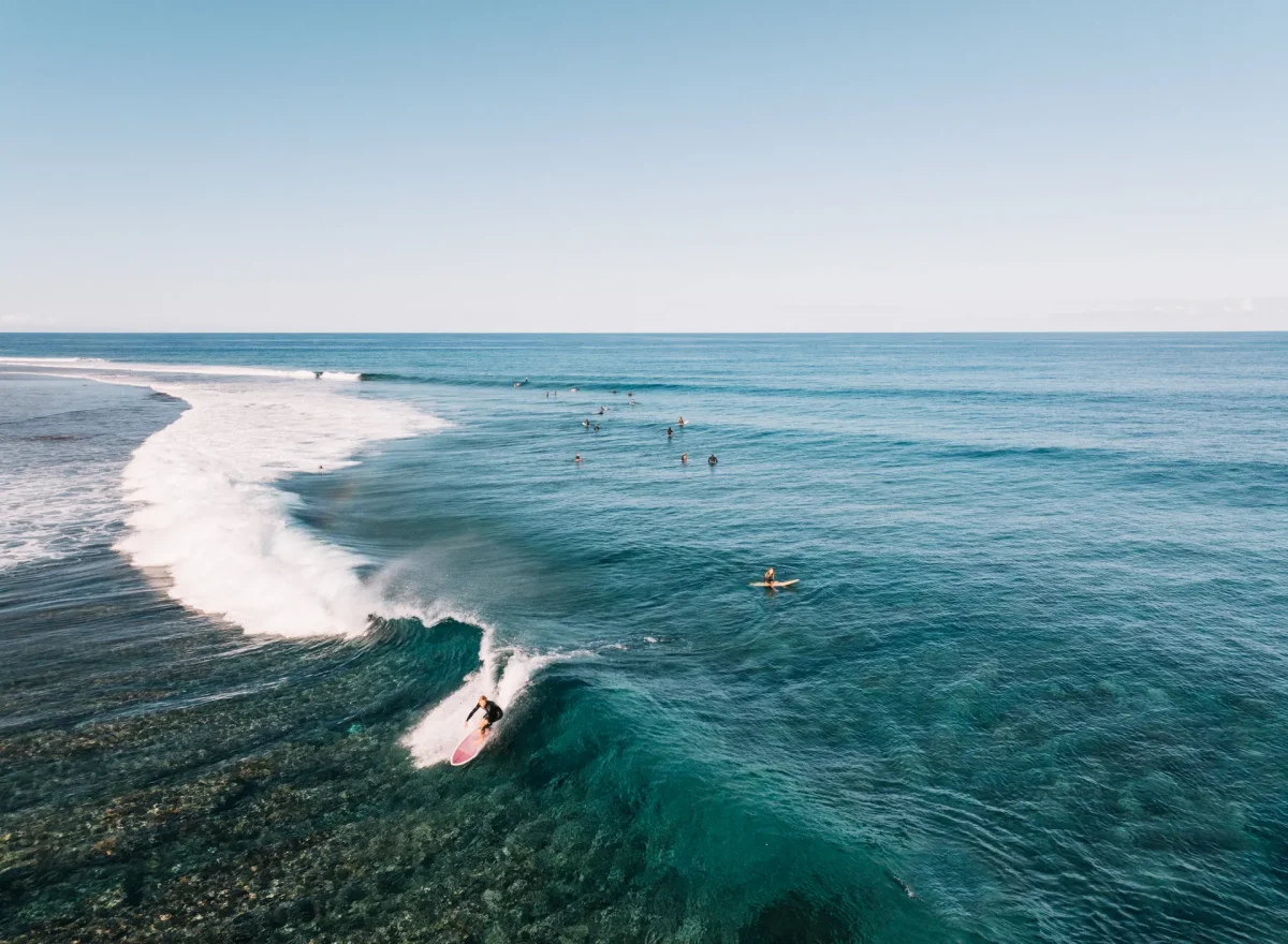 Surfer riding Cloudbreak near Six Senses Fiji